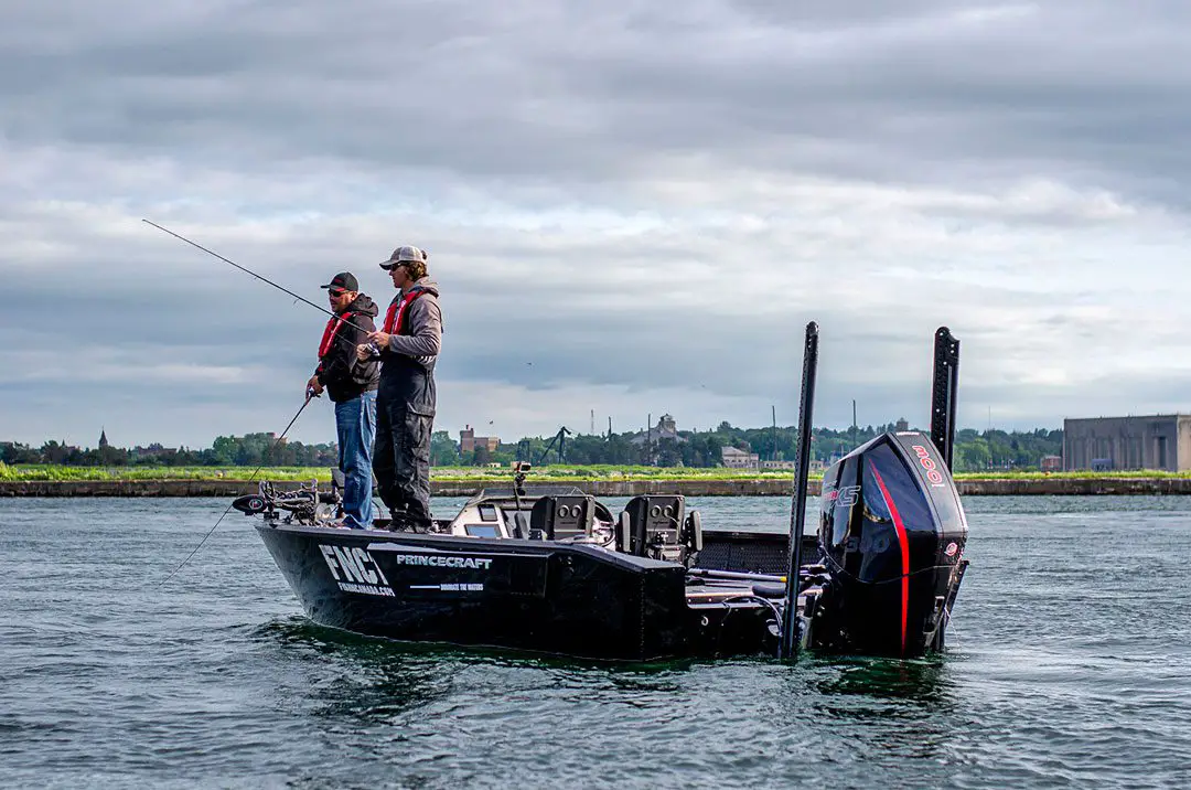 Steve and Tyler salmon fishing in front of Sault Ste. Marie