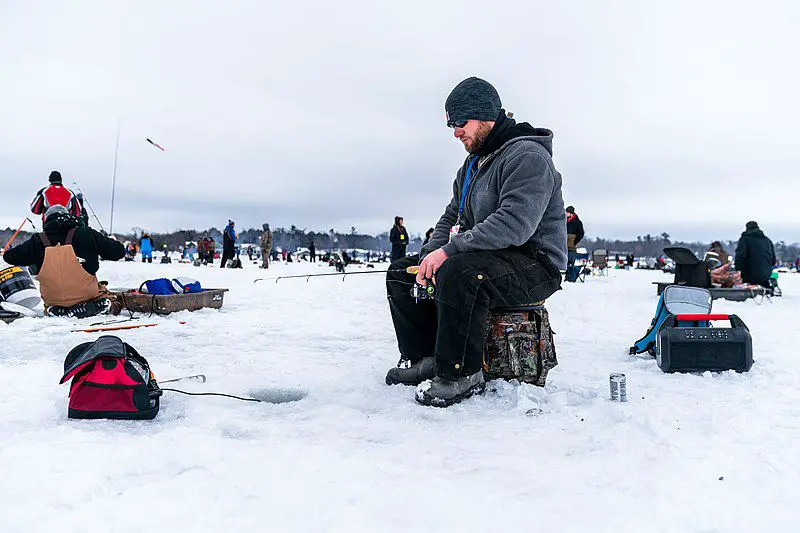 A busy lake full of ice anglers