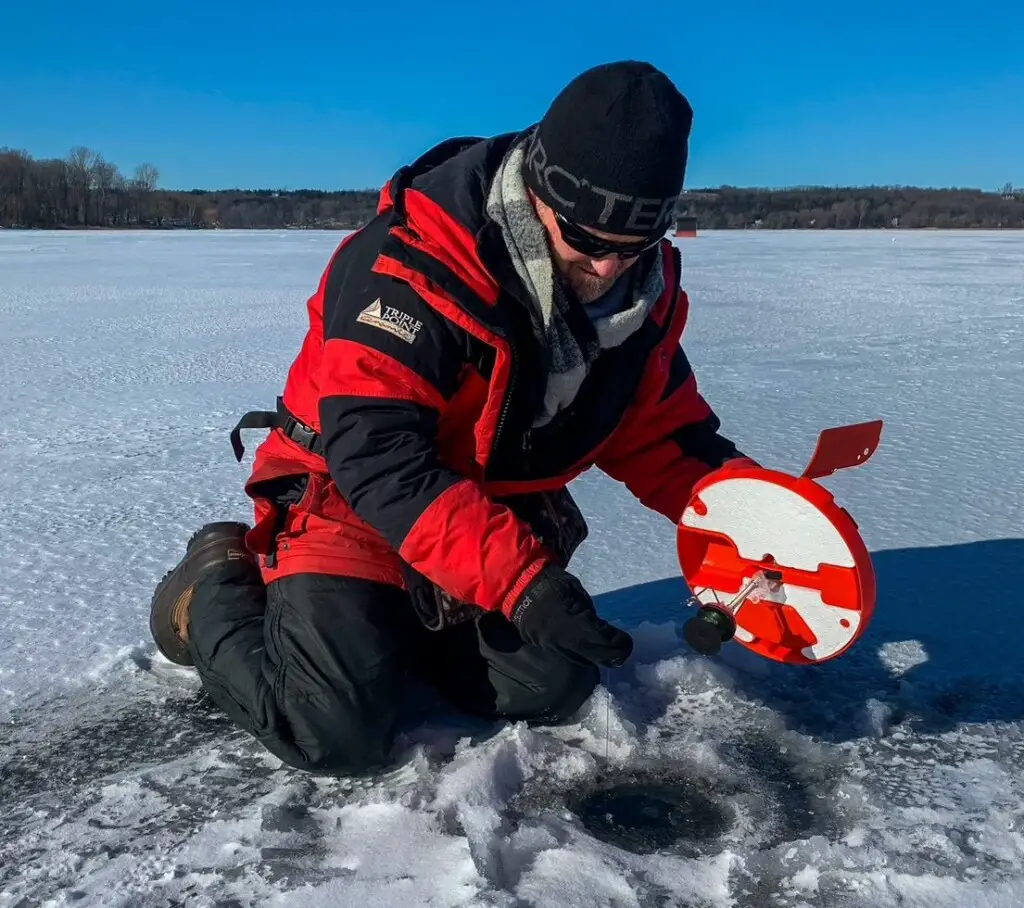 Pete Bowman showing that tip-up fishing  is a great strategy for midwinter ice fishing